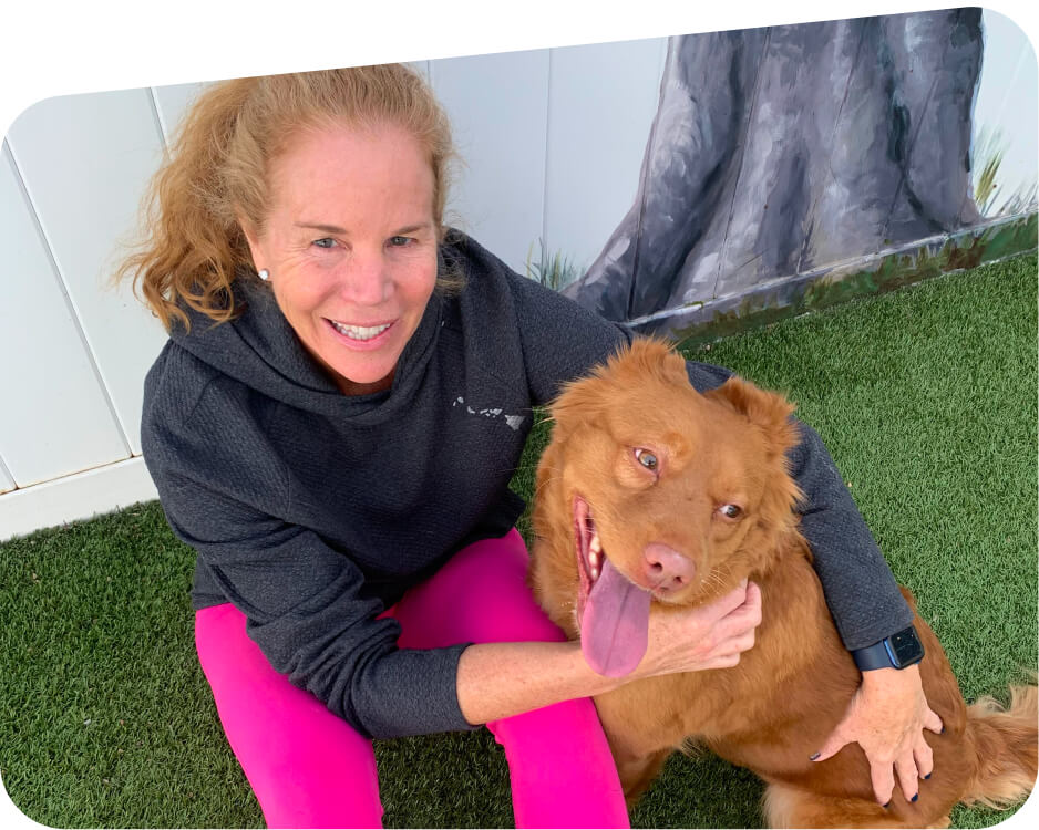 Lady holding dog